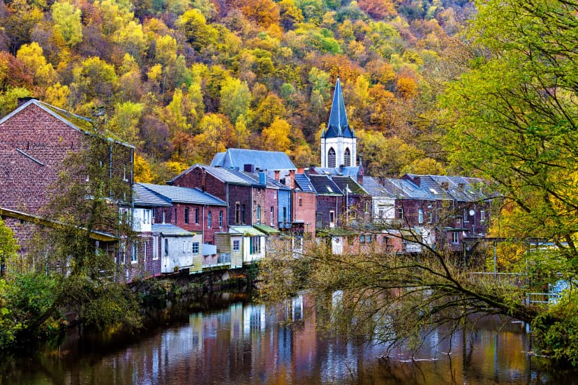 View of Vesdre river and church of Saint Francois Xavier in Belgian town of Chaudfontaine, Wallonia